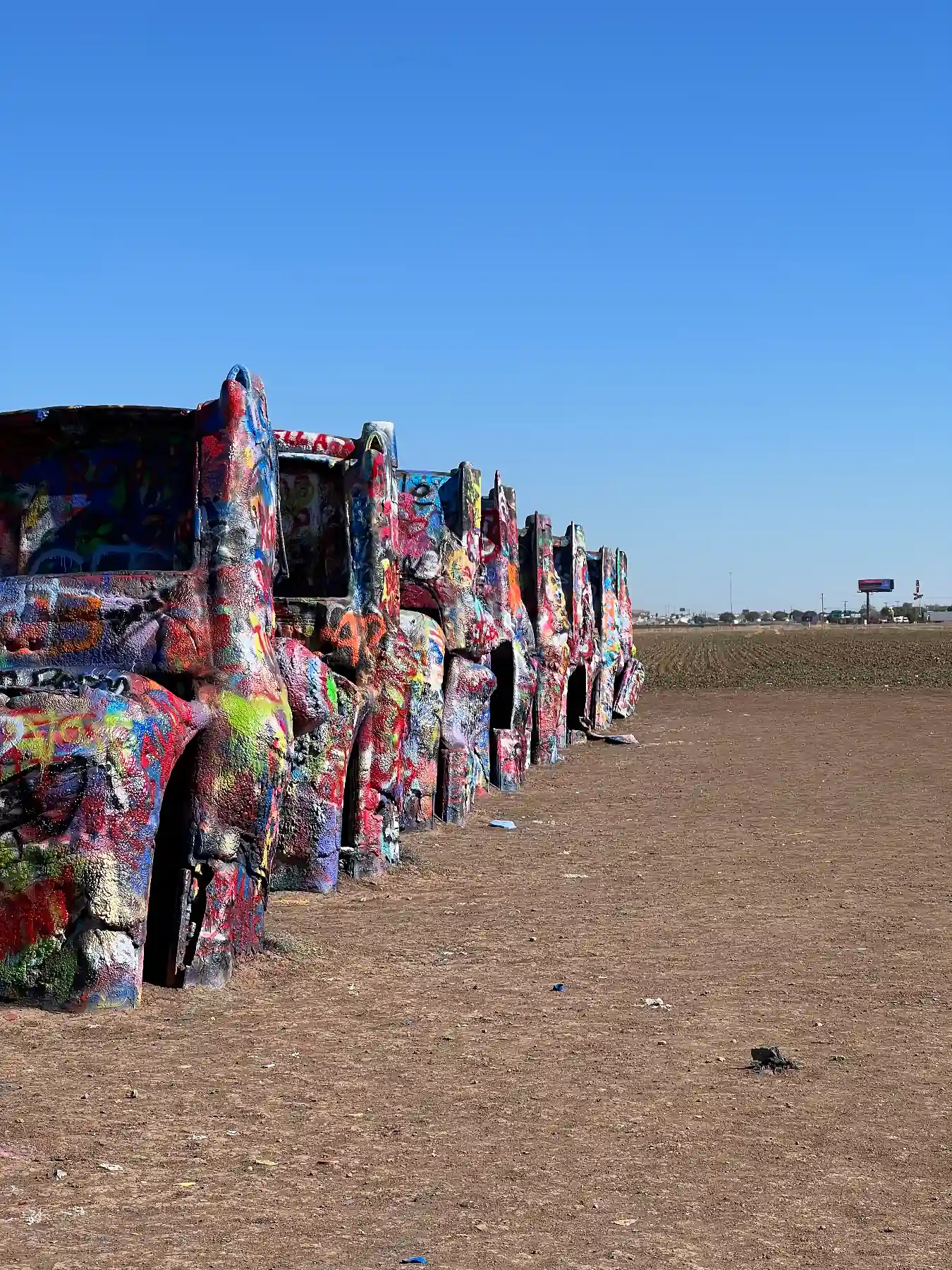 Painted Cadillacs buried halfway in ground graffiti amarillo texas